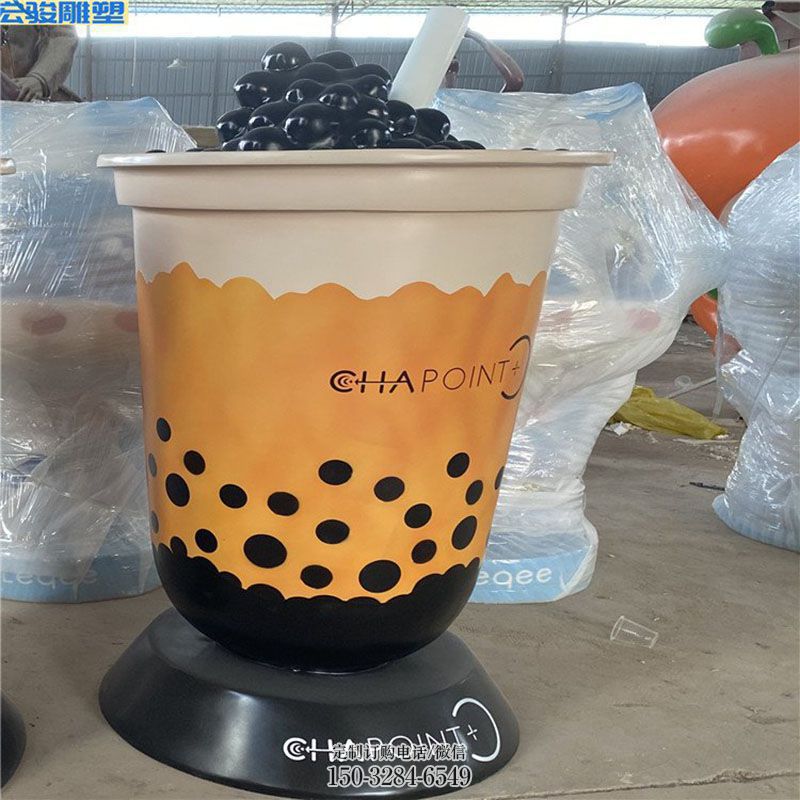 精选店门口奶茶雕塑主题